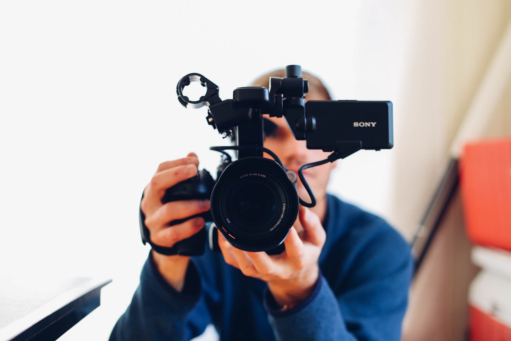 Marketer Holding Video Camera